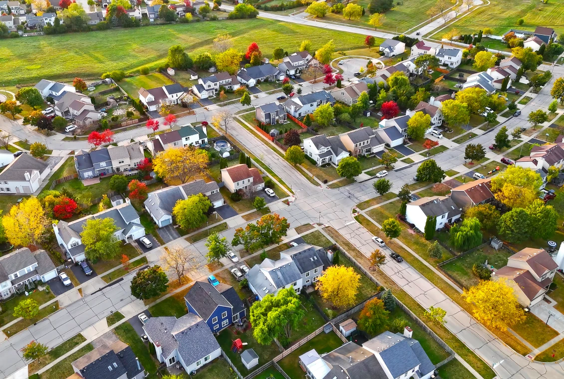 Aerial view of suburban neighborhood in autumn.